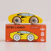 A bright yellow wooden No. 14 GT80 Lando supercar toy rests atop an orange box labeled “Made in England.” The packaging features icons for sustainable wood and a child-safe finish. Perfectly suited for ages 2 and up, this vibrant racing toy blends classic design with eco-friendly craftsmanship.