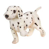 A Dalmatian Puppy Dog Stuffed Animal - Standing with black spots, crafted from high-quality materials, standing and looking to the side, isolated on a white background.