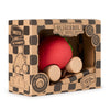 The Sweetie The Strawberry Baby Car is a red, strawberry-shaped natural rubber baby car toy with wooden wheels, packaged in a brown checkered box labeled "Oli & Carol," and suitable for ages 0+.