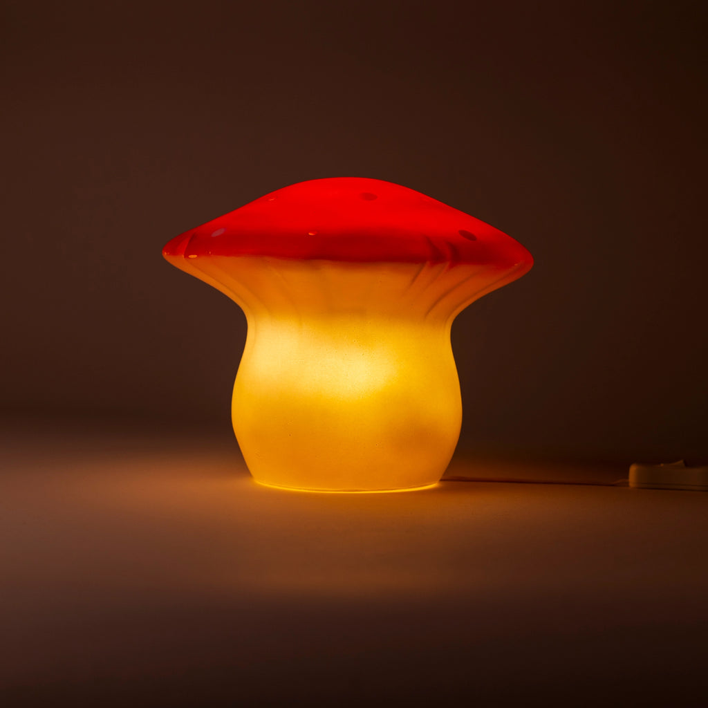 The Red Mushroom Lamp, with its glowing yellow stem and red cap, softly lights up any dark room—perfect for bringing a touch of magic to children's bedrooms or nurseries.