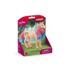 A limited edition Schleich Marshmallow Mare Unicorn figurine with a pink and purple mane, displayed in front of a forest-themed background and packaged in pink. Warning: contains small parts.