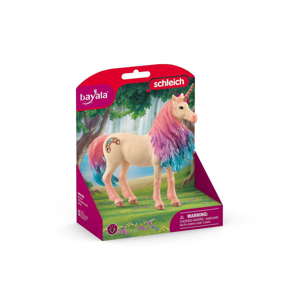 A limited edition Schleich Marshmallow Mare Unicorn figurine with a pink and purple mane, displayed in front of a forest-themed background and packaged in pink. Warning: contains small parts.