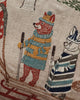 The Coral & Tusk Winter Fun Pillow features detailed embroidery of woodland animals, including a fox in a blue and yellow striped outfit with skis and ski poles, making it a whimsical holiday decor piece.