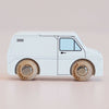 Presenting the No. 32 GT175 Frank | Made in England, a classic wooden toy van finished in white with black outlines and natural wood wheels—ideal for imaginative play and beautifully photographed against a plain light background.