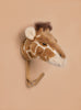 The Coat Hanger - Giraffe features a giraffe head design in soft plush with brown and cream patterns, mounted on a tan background, making it a charming animal-themed wall hook.