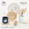 A ten-piece Cutlery & Dinner Set for pretend play, including plates, cups, and cutlery adorned with floral and animal illustrations.