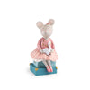 The Moulin Roty Money Box - The Little School of Dance features a hand-drawn mouse in a pink dress with ballet shoes, sitting on blue gift boxes and holding a swan—perfect for children's bedroom decor.