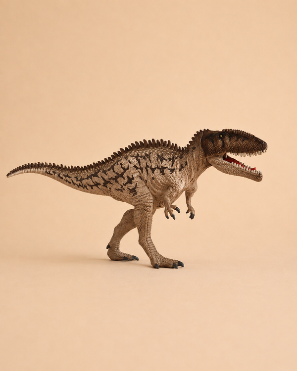 The Schleich Carcharodontosaurus Dinosaur Toy, featuring a brown textured body with black markings, stands on two legs against a plain beige background with its mouth open to reveal small teeth.