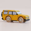 The No. 35 GT195 Riley | Made in England is a yellow wooden 4x4 toy car featuring wooden wheels, black-tinted windows, and simple printed details, photographed on a plain light background—perfect for little ones who love adventure toys and off-road vehicles.