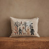 The Coral & Tusk Full Moon Masquerade Pillow, Oeko-Tex certified, features embroidered animals in costumes on beige linen—perfect for adding charming Halloween decor to any space.