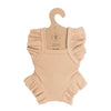 Blush Frilled Bodysuit for 13″-14″ dolls, crafted from ribbed cotton with charming ruffled sleeves and leg openings. Displayed on a cardboard hanger labeled “Handmade 100% cotton,” this handmade doll clothes piece is perfectly sized for Minikane dolls and adds a delightful touch to any collection.