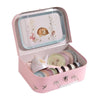 The Moulin Roty Tea Party Suitcase - The Rosalies is a pink case with bird designs containing a charming children’s metal tea set, including a teapot, cups, saucers, and tray decorated with a bear and floral illustration.