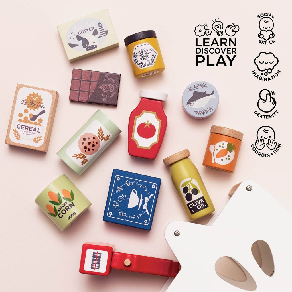 The Groceries Set & Scanner features cereal, chocolate, butter, corn, olive oil, and canned goods on a light background. Icons highlight key benefits: social skills, imagination, dexterity, and coordination.