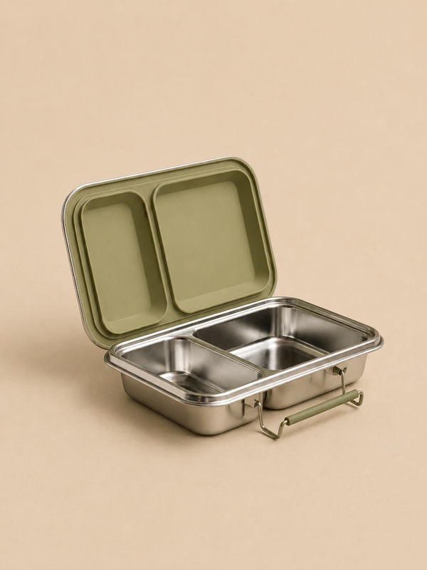 A Haps Nordic stainless steel lunch box with two compartments and an open lid edged in olive green is displayed on a beige background. This eco-friendly container features a practical front handle, making it ideal for meals on the go.