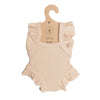 The Mrs. Ertha Doll Clothes - 13″-14″ Ivory Frilled Bodysuit is an ivory ribbed onesie for dolls, featuring charming ruffled sleeves and leg openings. Displayed on a brown cardboard hanger labeled “Handmade 100% cotton,” this organic cotton bodysuit is perfect as a handcrafted outfit for Minikane dolls or other dolls measuring 13 to 14 inches.