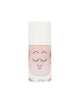 A bottle of Nailmatic pink water-based nail polish with a cute face design and smiling eyes, isolated on a white background. The cap is white and the bottle contains shimmering particles.
