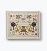 Introducing the Storybook Embroidered Baby Book: a cream-colored memory book adorned with delicate embroidery and charming illustrations of a bear, giraffes, trees, swan, rocking horse, houses, and flowers. The elegant cursive cover reads “Sweet Little One,” making it the perfect keepsake for capturing your child’s precious milestones in timeless style.