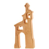 An Ostheimer Bell Tower resembling a tall, stylized church with several cutout windows and an arched doorway. There is a small, visible bell hanging in the top window. Made from light-colored, sustainably sourced wood with a smooth finish, it sparks imaginative play for all ages.