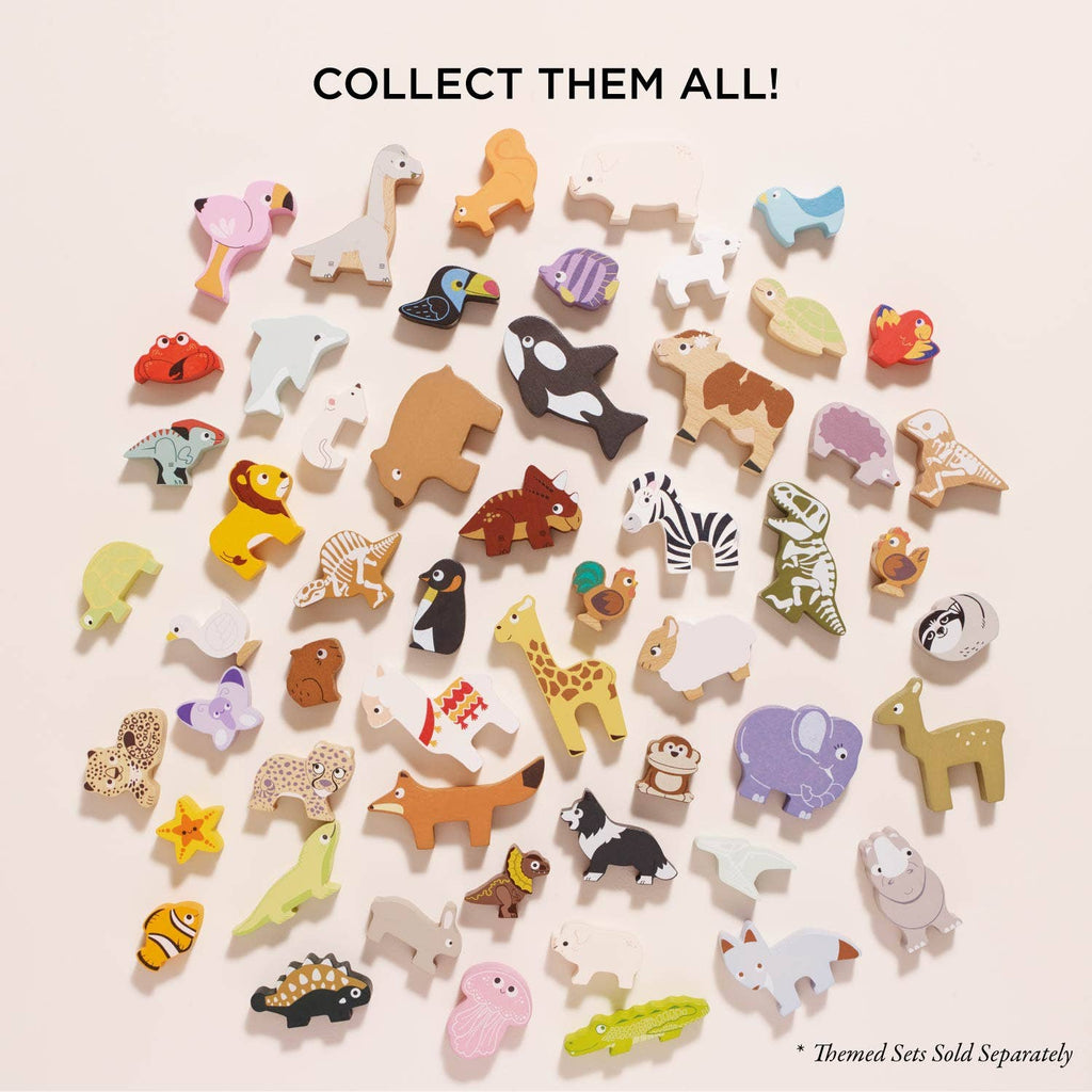 Ocean Life Stacking Animals & Bag features colorful wooden sea creature figurines on a light background—perfect for sensory play! Text at top reads "COLLECT THEM ALL!" Small print at bottom says "*Themed Sets Sold Separately.
