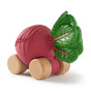 Betty The Beetroot Baby Car is an eco-friendly, playful toy with a pinkish-red body, green leafy top, and four rounded wooden wheels—crafted for fun and sustainability.