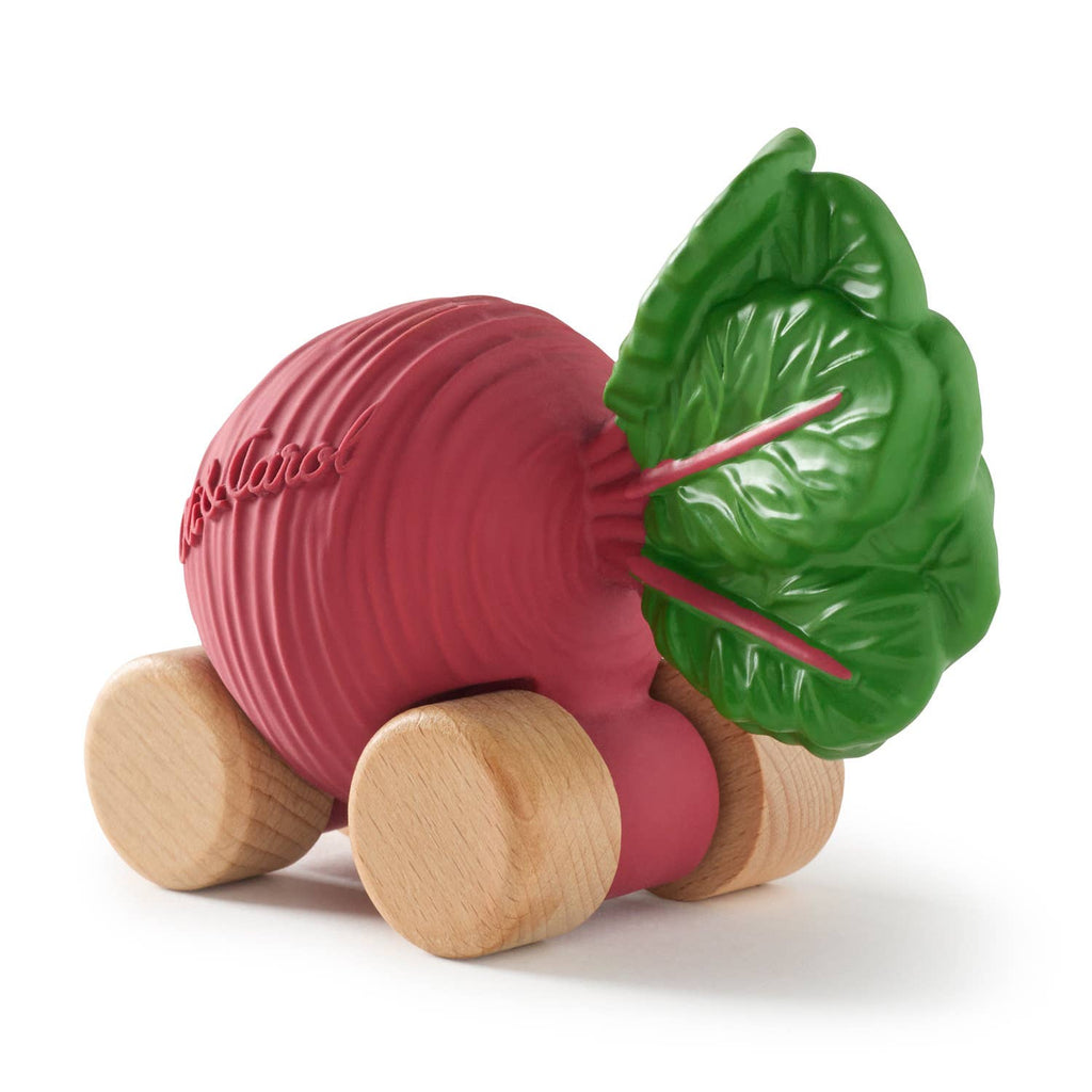 Betty The Beetroot Baby Car is an eco-friendly, playful toy with a pinkish-red body, green leafy top, and four rounded wooden wheels—crafted for fun and sustainability.