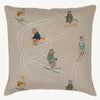 The Coral & Tusk Downhill Skiers Pillow is a square beige embroidered cushion featuring a fox, raccoon, rabbit, and bear skiing in different directions with white stitched ski trails.