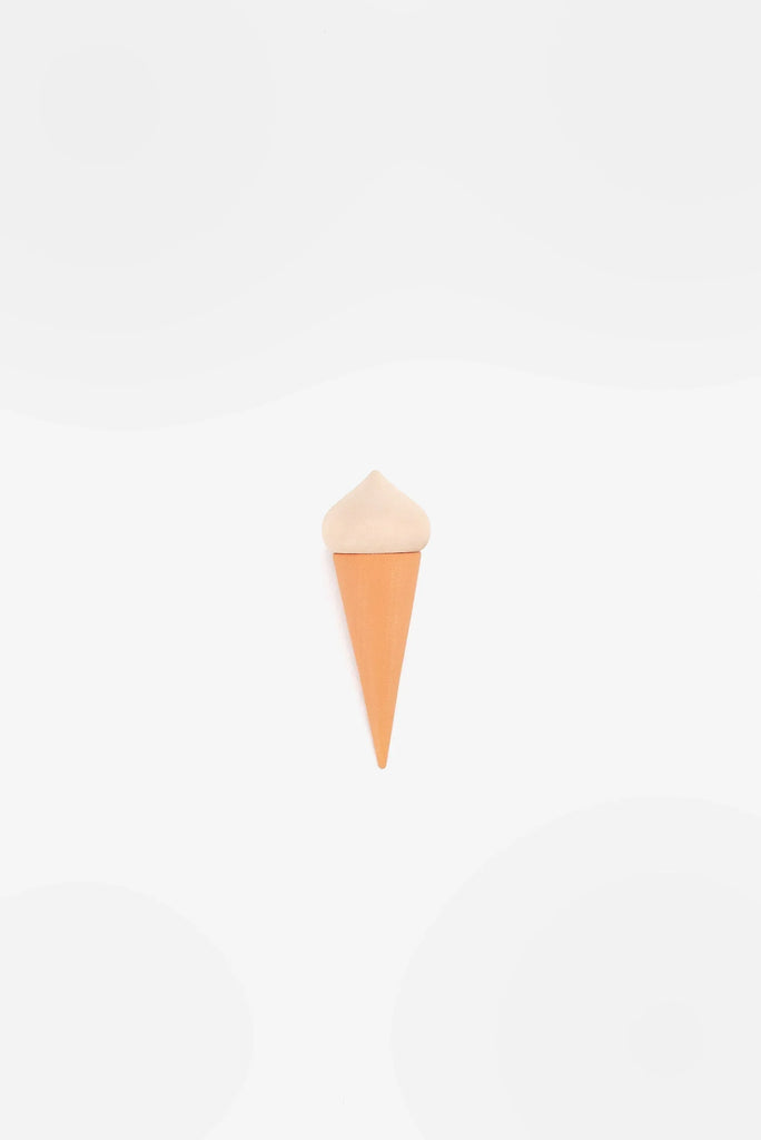 A minimalist image of a simple, cone-shaped Handmade Ice Cream Cone, set against a plain white background with soft, blurry gray circles.