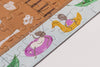 A close-up of the Beneath the Branches 200 Piece Puzzle shows cartoon ants relaxing on pool floats—one on a purple ring with a drink, another on a yellow duck—all crafted from matte pieces with green leaves and water in the background.