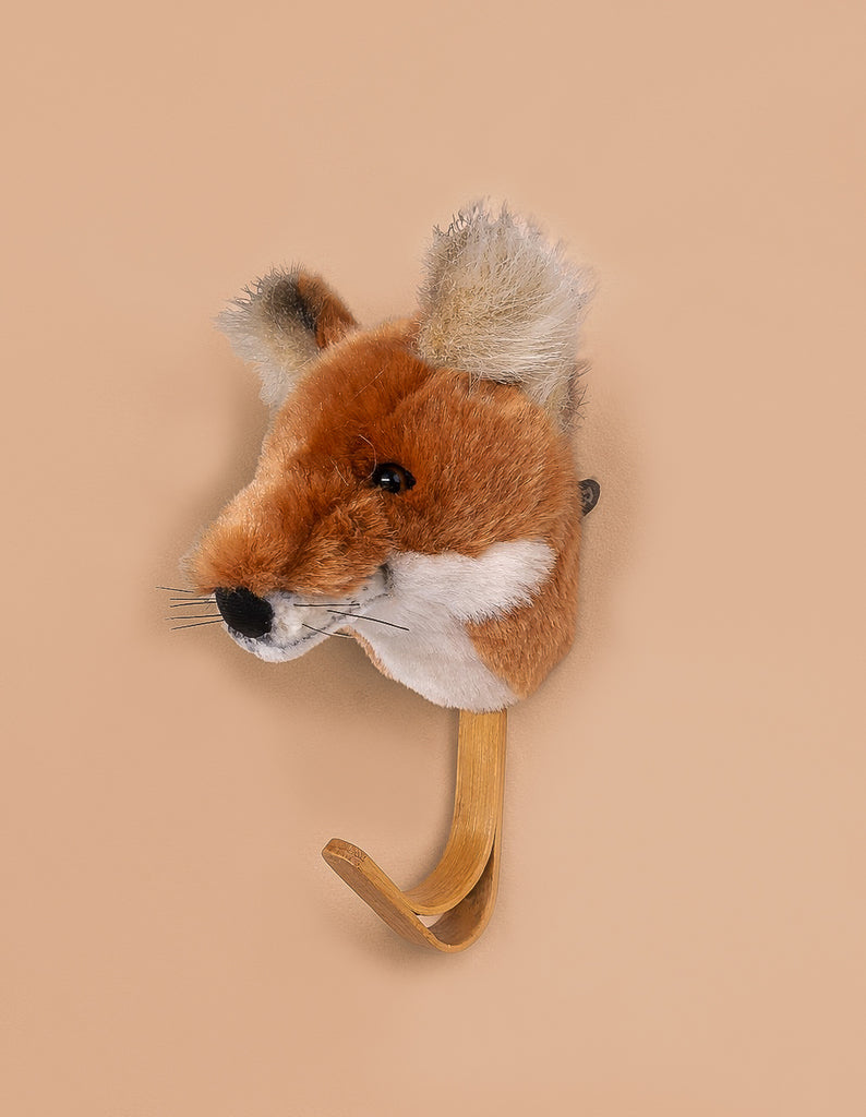 The Coat Hanger - Fox is a wooden animal wall hook featuring a fox's head with lifelike orange, white, and black fur details, set against a simple beige background.