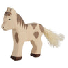 The Holztiger Foal, Standing is a handcrafted wooden toy with brown spots, a brown mane, a heart-shaped side spot, and a cream-colored yarn tail—an endearing European-made figure on four sturdy legs.