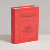 A red, book-shaped Monopoly Junior Vintage Bookshelf Edition game box featuring a circus tent illustration on the cover and spine.