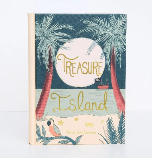 The Collector's Edition hardcover of "Treasure Island" by Robert Louis Stevenson showcases an elegant cover featuring palm trees, a parrot, a sailing ship on the water, and a large moon illuminating the background. The book title is elegantly displayed across the middle.