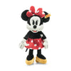 The Steiff, Disney's Minnie Mouse Stuffed Plush Toy, standing upright at 12 inches, is part of the Soft Cuddly Friends Collection and perfectly matches her classic Disney Originals design. Dressed in a red and white polka-dot bow and skirt, she features large black ears, white gloves, yellow shoes, and wears a cheerful expression on her face.