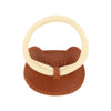 A children's teething ring featuring a light tan circular silicone ring attached to a brown Donsje Leather Hair Tie - Bear holder with the brand name "donsje" stamped on it.