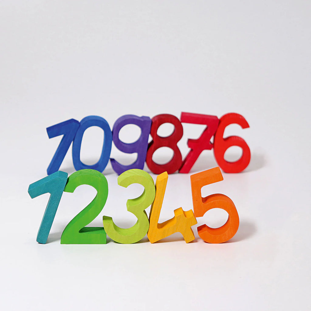 Grimm's Building Set - Numbers features colorful wooden numbers 1-9 in green, yellow, orange, red, purple, and blue. Perfect for stacking and building, they help develop motor skills as kids play and learn.