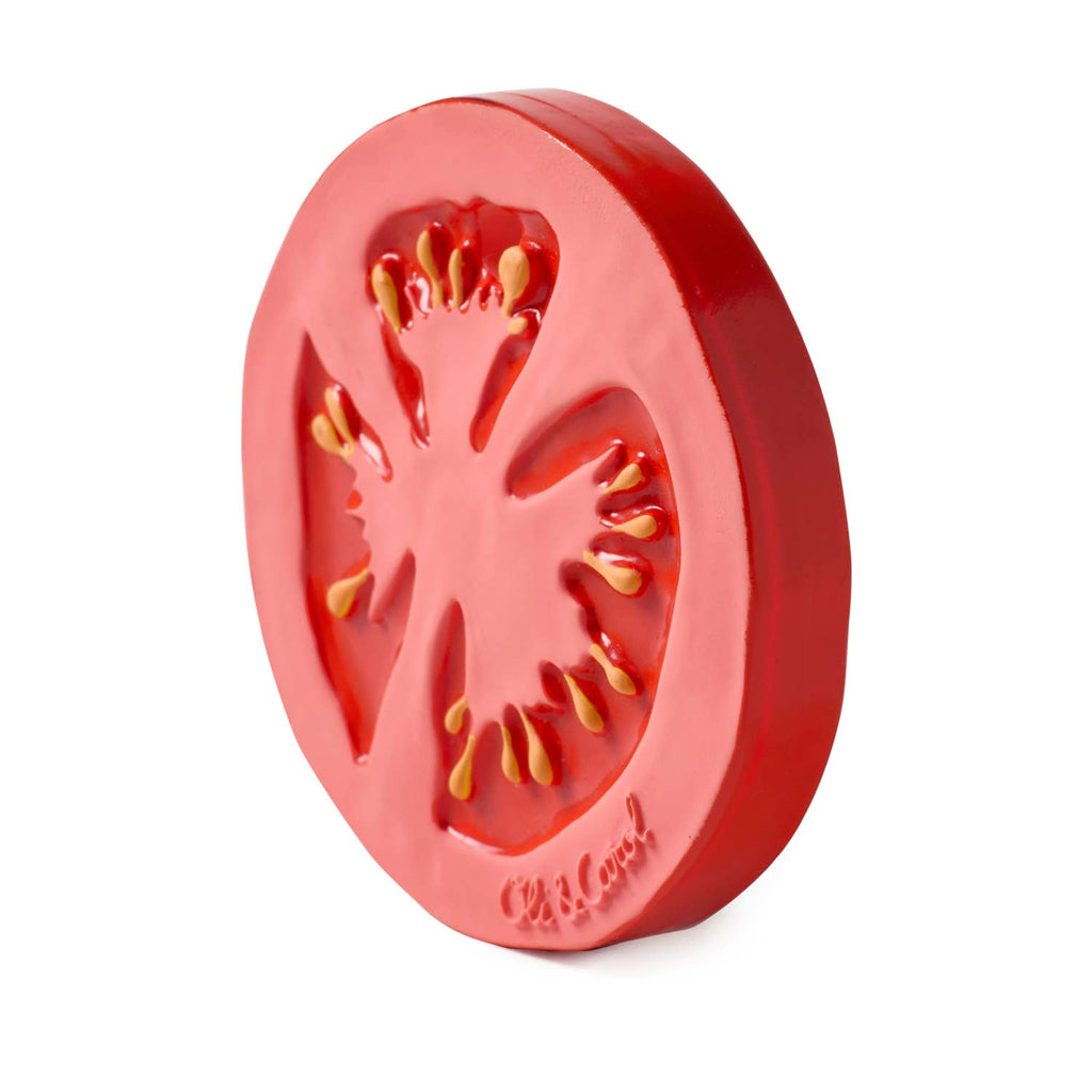 Renato the Tomato Teething Toy is a novelty baby teether shaped like a bright red tomato slice with detailed seeds and inner markings, made from eco-friendly materials and photographed upright on a white background.