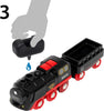 A hand pours a blue water droplet from a small black container into the BRIO World Christmas Steaming Train Set, labeled "120" in black and red. The number 3 is shown in the top left corner.