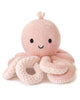 The Cuddle + Kind Baby Octopus (Soft Coral Pink) is a hand-knit, heirloom-quality plush toy with a smiling face and eight curled tentacles, crafted from Peruvian cotton yarn and shown against a white background.