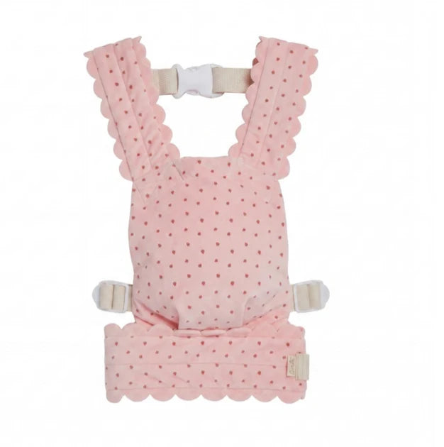 An Olli Ella Petal Doll Carrier - Strawberry, featuring a charming pink color with scalloped edges and a small dot pattern, comes equipped with straps and buckles for securing. This kid-sized carrier is perfect for little ones to carry their favorite doll.