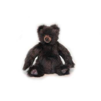 The Brown Mikey Bear Stuffed Animal, 12", features dark brown, fluffy fur and a lighter brown snout. It sits upright with pink paw pads on display—crafted with realistic details for plush animal fans.