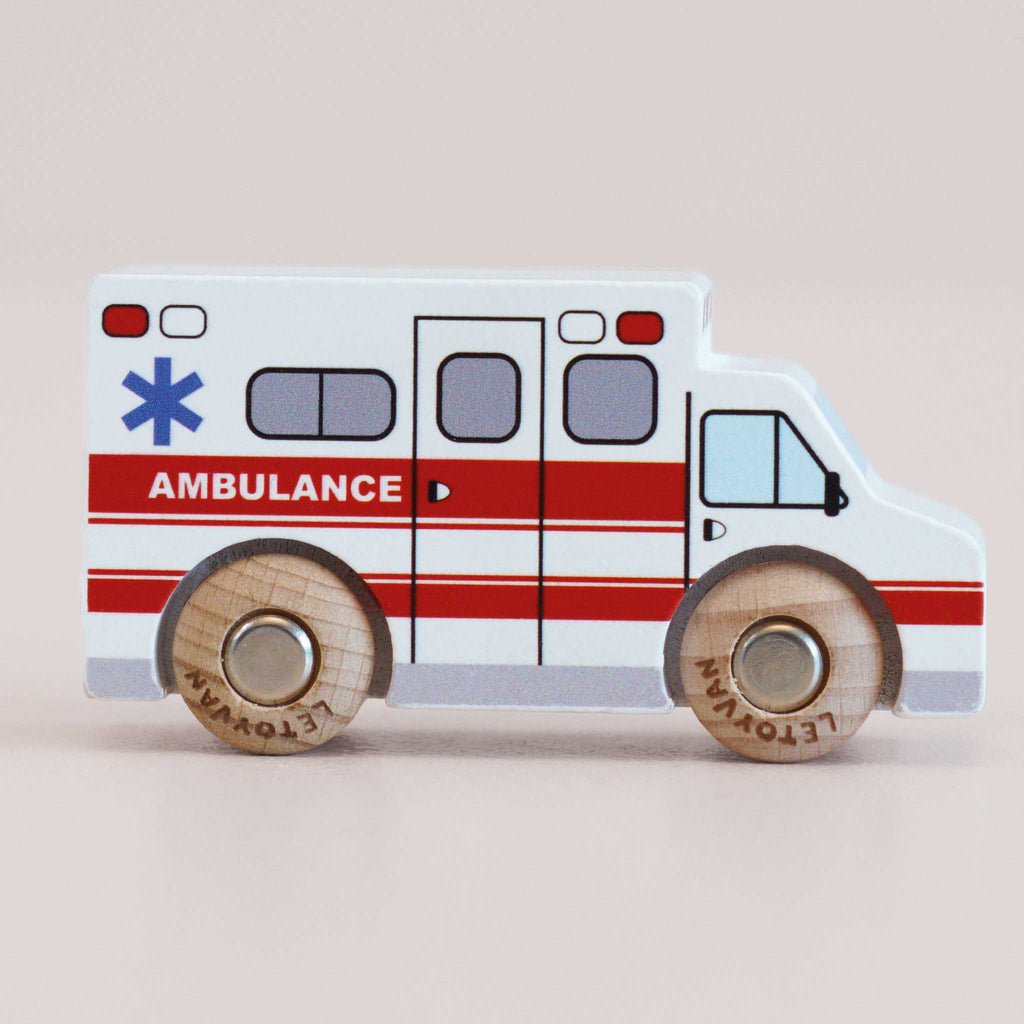 No. 43 GT265 Lance | Made in England — a wooden toy ambulance featuring red and white stripes, a blue medical star symbol, and wooden wheels on a plain background—perfect for imaginative play and exciting rescue stories.