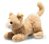 The Cassie Cat Plush Toy showcases soft, light brown fur and a white face, depicted in a playful crouched position. It includes a small yellow tag on its ear and has a curled-up tail, making it the perfect huggable companion.