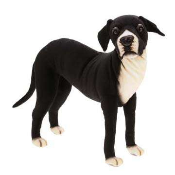 A black and white Great Dane stuffed animal, artisan hand sewn, standing against a white background, featuring prominent tan paws and a lifelike expression.