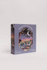 The Mischief Under the Moonlight 300 Piece Puzzle features a nighttime forest scene with animals and colorful lights. Its matte, recycled pieces come in a purple box labeled for ages 9 and up.