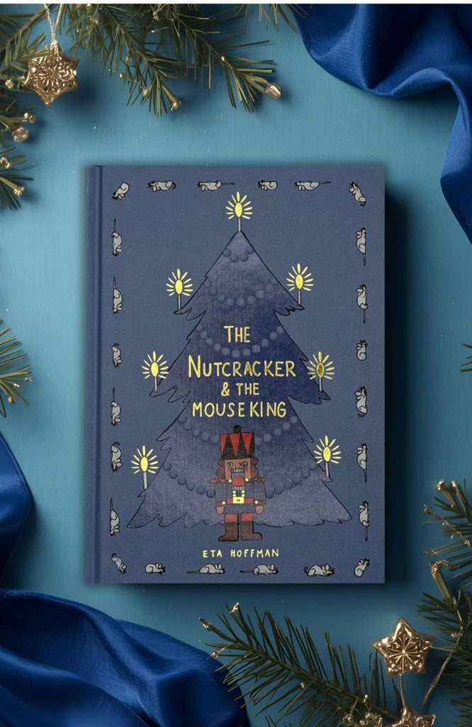 The Nutcracker | Collector's Edition | Hardcover features a festive cover with a blue Christmas tree, yellow lights, ballet-themed nutcracker and mouse, pine branches, gold ornaments, and blue ribbon.