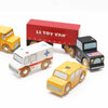 The American Wooden Car Set features five colorful vehicles—a yellow school bus, red delivery truck, black police car, white ambulance, and yellow taxi—ideal for imaginative play or pairing with wooden train sets.