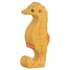 The Holztiger Seahorse is a handcrafted wooden toy, painted yellow with orange accents and simple facial features. Made in Europe, it stands upright and is perfect for imaginative play or display.