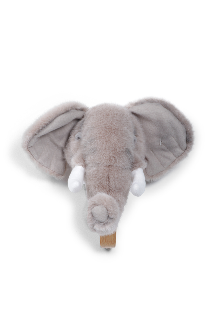 The Coat Hanger - Elephant features a plush elephant head with large floppy ears, white tusks, and a soft gray finish, serving as a charming animal wall hook to add whimsy to any space.