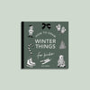 A green cover book titled "Winter Things: How to Draw Books for Kids" by Alli Koch features an elf, mittens, tree, candy cane, ice skates, and a bear—perfect for beginner kids’ winter drawing lessons.