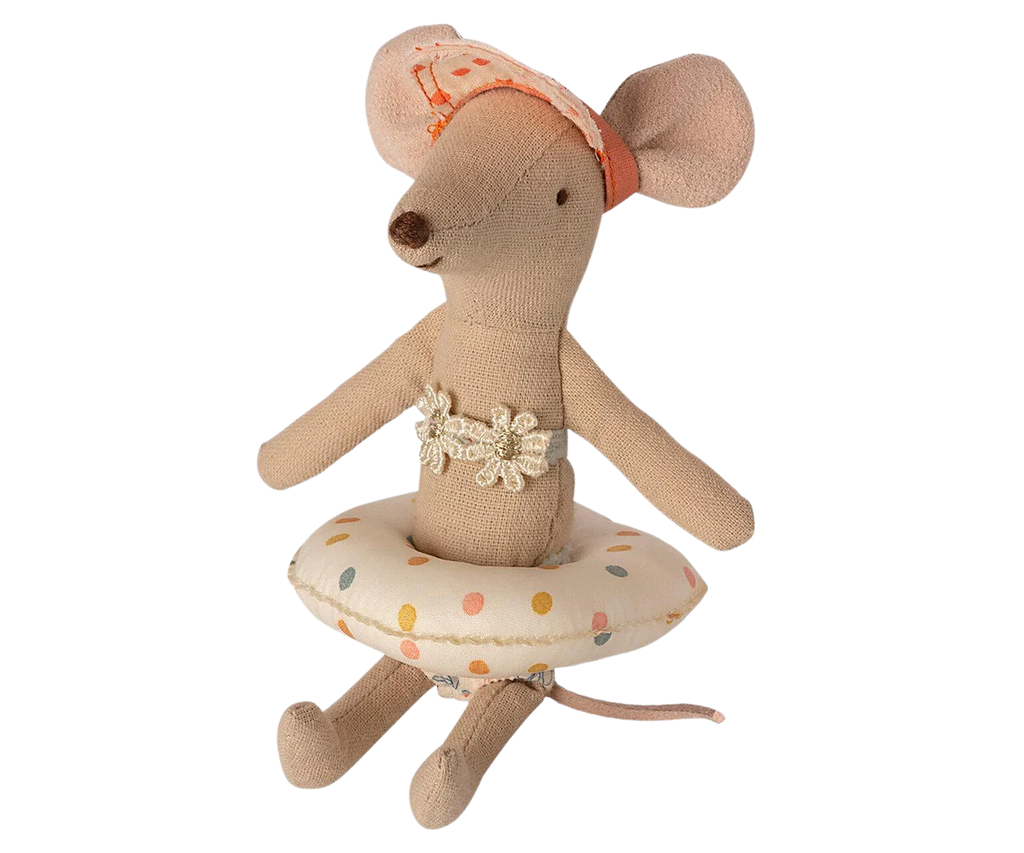 The Maileg Tube, Small Mouse - Multi Dot features a small plush mouse toy adorned with a floral headband and a polka dot inner tube around its waist, making it look swim-ready. This adorable mouse has an embroidered face with a pointed nose and is accessorized with a decorative bow around its chest.